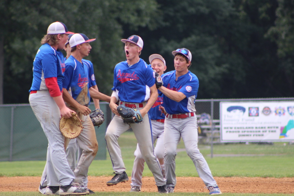 Members of the Augusta 15U Babe Ruth team, including Cole Lockhart, Jake Hendsbee, Dylan Presby, Isaiah Magee, Cody Taylor and Jake Wroton, celebrate after they defeated Cranston, R.I., 2-1 in a New England Regional game Sunday morning at Trumbull (Conn.) High School.