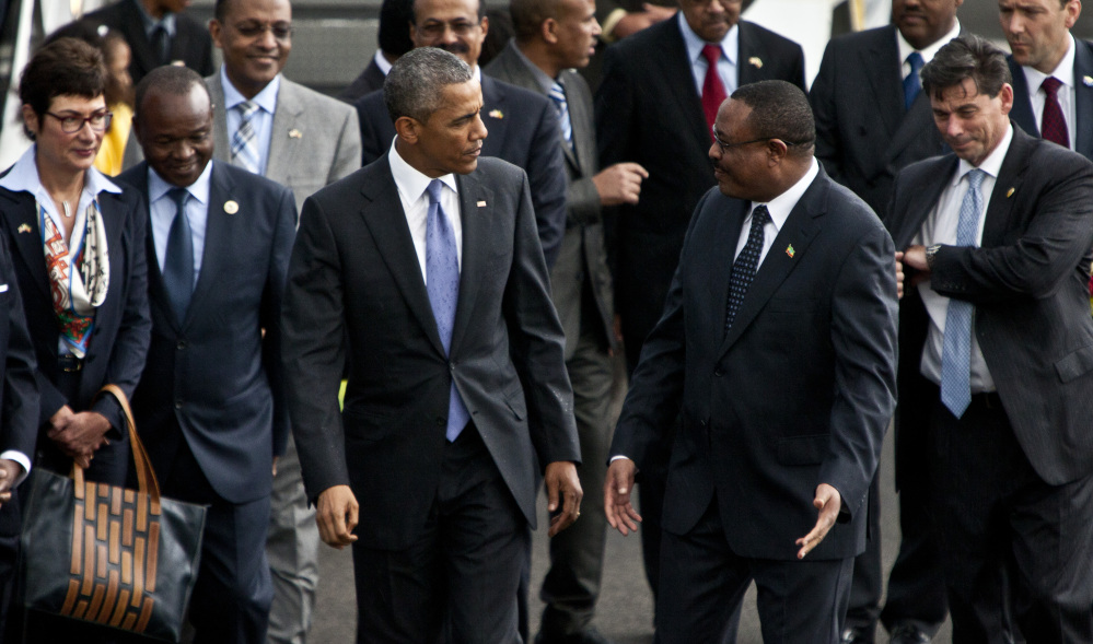 The Associated Press U.S President Barack Obama, left, walks with Ethiopian prime minister Hailemariam Desalegn, right, after his arrival at Bole International Airport, Addis Ababa, Ethiopia.