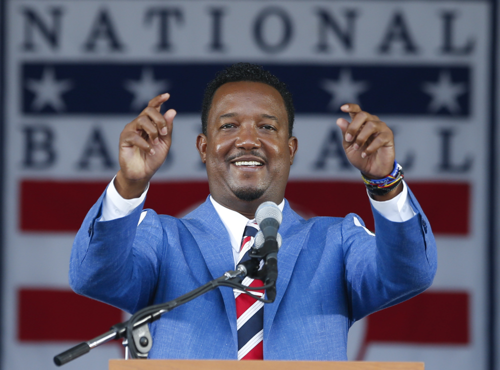 National Baseball Hall of Fame inductee Pedro Martinez speaks during an induction ceremony at the Clark Sports Center on Sunday in Cooperstown, N.Y.