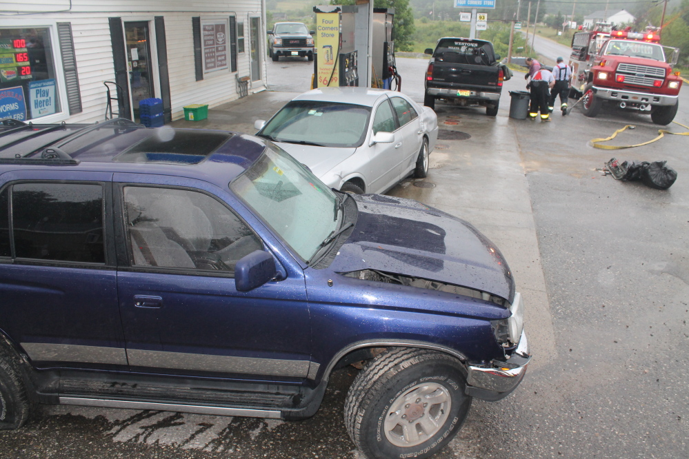 Police said a driver running a stop sign at Four Corners General Store in West Gardiner caused an accident involving three vehicles, including the blue Toyota SUV in the foreground and the silver Lincoln sedan behind it.