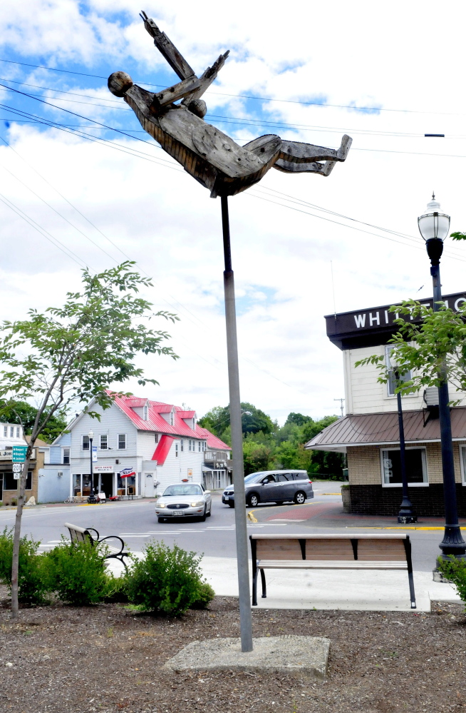 The “Falling Woman” sculpture by Bernard Langlais now graces downtown Skowhegan on Thursday.