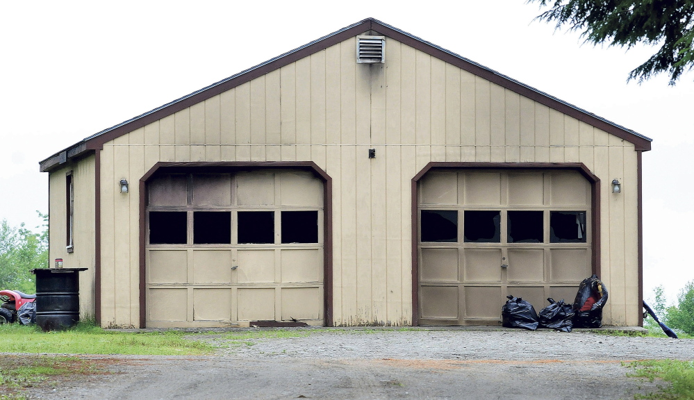 Smoke stains and broken windows mar this garage at 142 Waite Hill Road in Cornville on Monday, where homeowner Tony Kimball was burned and hospitalized after a Sunday fire.