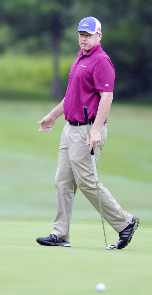 Staff photo by Andy Molloy 
 Shawn Warren, of Cape Elizabeth, reacts to a putt during the the first round of the Charlie's Maine Open Monday at the Augusta Country Club in Manchester.