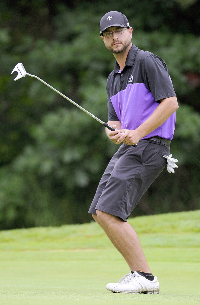 Staff photo by Andy Molloy 
 Ashley Fifield, of Westbrook, reacts to a putt during the the first round of the Charlie's Maine Open Monday at the Augusta Country Club in Manchester.