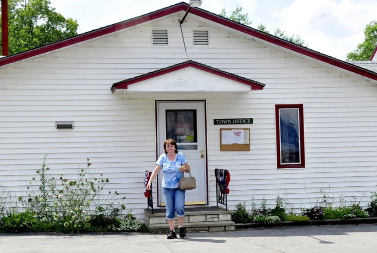 Resident Julia Greene leaves the Anson town office on Tuesday afternoon.