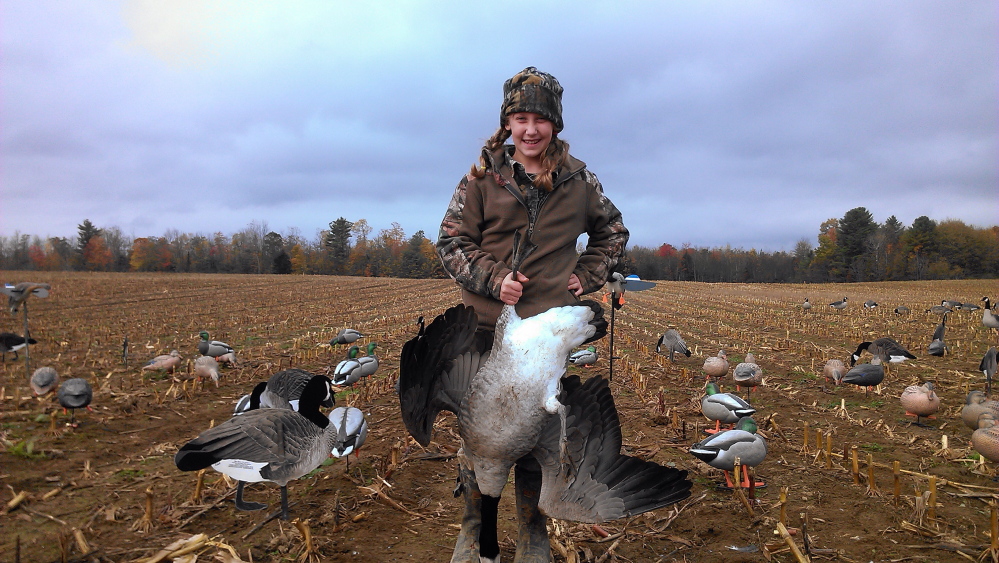 Youth writing contest winner Emma Hegenaars, of Readfield, with her first Canada Goose taken during a waterfowl hunt with her father and grandfather.
