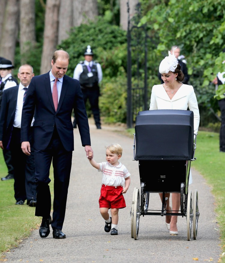 Britain’s Prince William, Kate the Duchess of Cambridge, their son Prince George and their daughter Princess Charlotte arrive for Charlotte’s Christening at St. Mary Magdalene Church in Sandringham, England, Sunday.