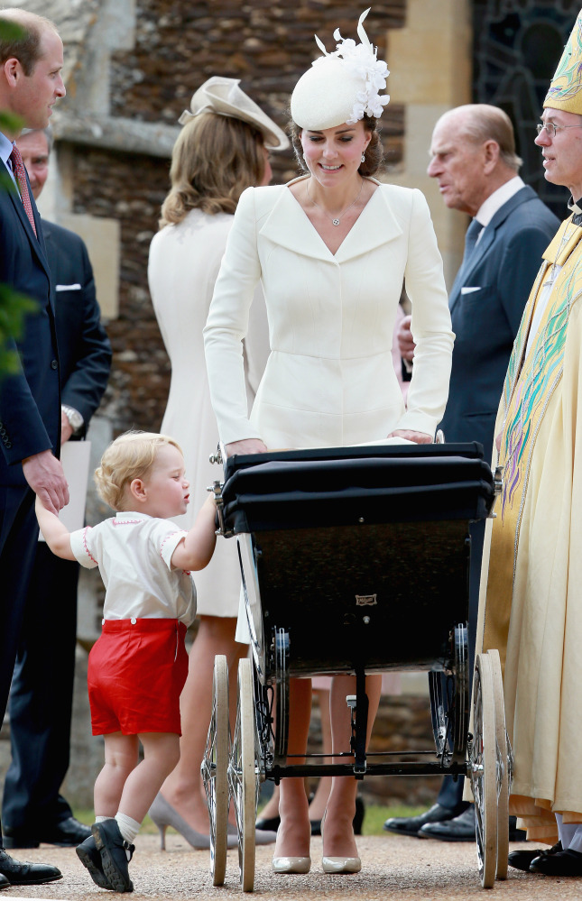Britain’s Kate the Duchess of Cambridge leave the Church of St Mary Magdalene with daughter Princess Charlotte after her christening on the Sandringham Estate, England, Sunday.