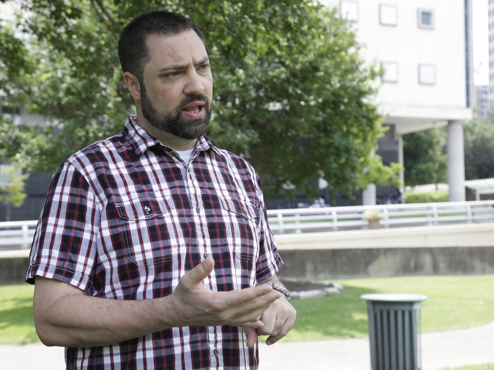 Jeremy Alcede talks about his legal issues Friday outside the federal courthouse in Houston.