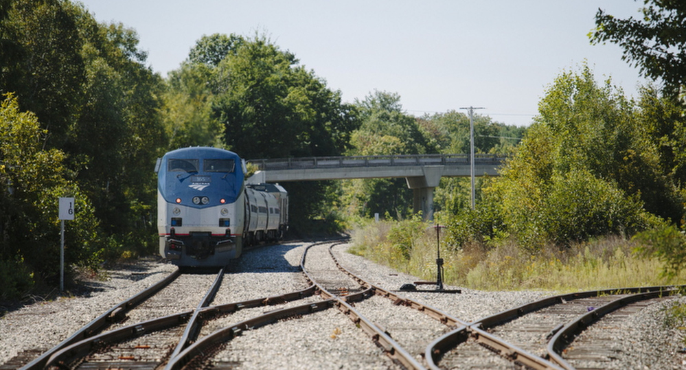 An Amtrak Downeaster train sits on the tracks near the Brunswick station.
