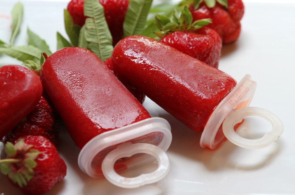 Strawberry-lemon verbena popsicles made with fresh strawberries, lemon verbena and simple syrup.