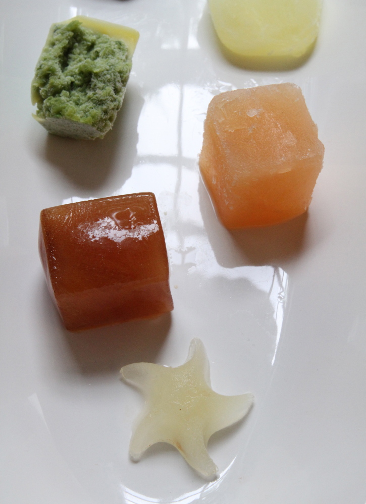 Some of the leftovers frozen in ice trays, clockwise from bottom, are lime (star-shaped), tea, garlic scapes, egg whites and grapefruit juice.