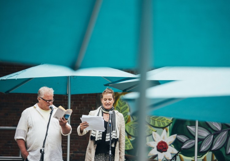 Daniel Noel and Moira Driscoll, actors with Portland Stage Company, read excerpts Tuesday of Harper Lee’s “To Kill a Mockingbird” in Congress Square Plaza, before doing readings from the new novel “Go Set a Watchman.”