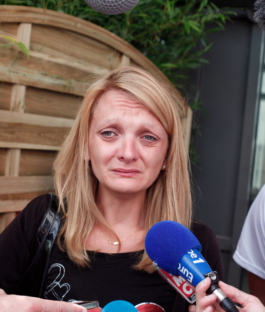 Rachel Lambert speaks in Reims, France, on Thursday about pulling life support for her husband. The Associated Press