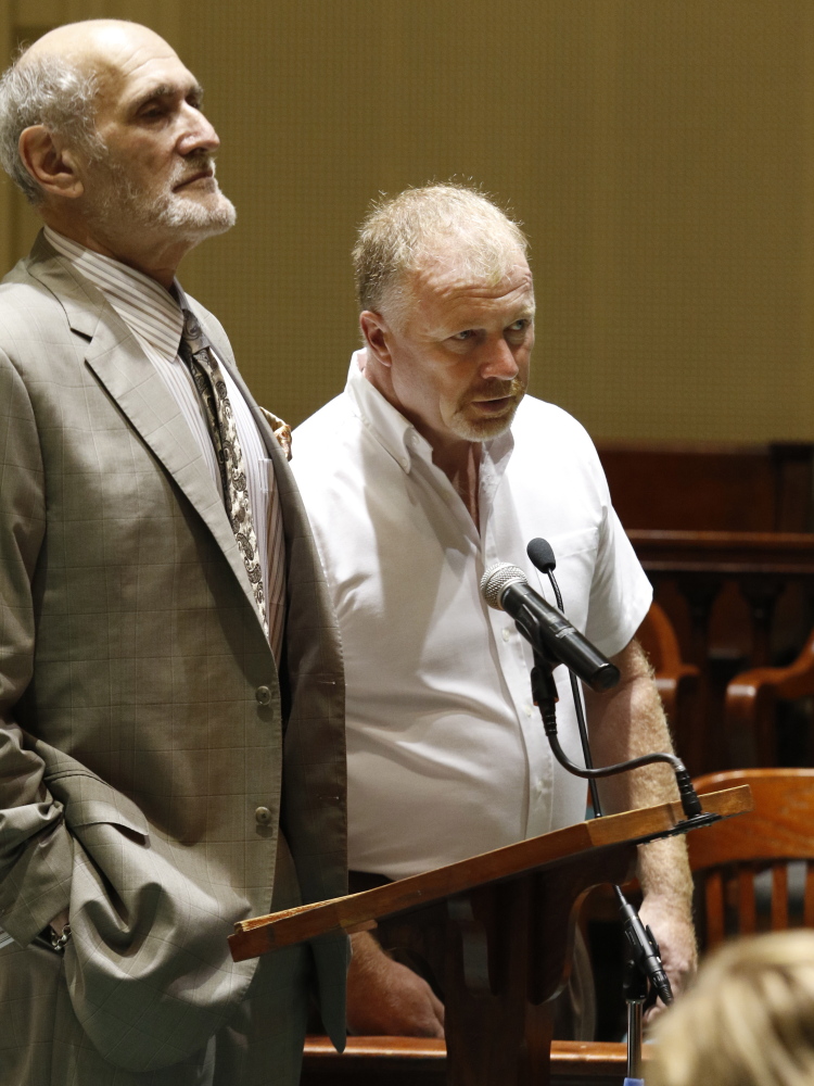 David Brown, right, the driver in last year’s fatal hayride crash in Mechanic Falls, appears in court Thursday with his attorney Leonard Sharon. Brown pleaded not guilty to a misdemeanor charge of reckless conduct.