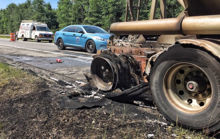 A fire in the right rear wheel of a truck hauling ash on I-95 at mile 56 on Thursday morning was probably cause by overheated bearings, according to Maine State Police on the scene. 