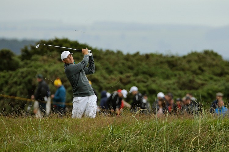 Jordan Spieth plays his third shot on the 14th hole during the first round of the British Open Golf Championship at the Old Course, St. Andrews, Scotland, Thursday.
The Associated Press
