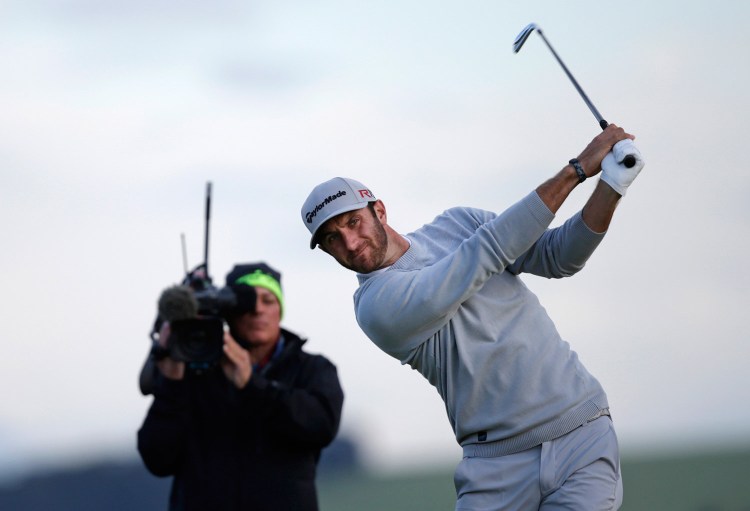 Dustin Johnson of the United States tees off from the 7th hole during the second round of the British Open Golf Championship at the Old Course, St. Andrews, Scotland, on Friday.