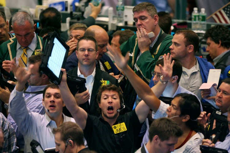 Crude oil options traders work on the floor of the New York Mercantile Exchange in New York in 2007. Most pits in Chicago and New York where traders bet on future prices of palladium and gold, cattle and corn and dozens of other commodities closed for good Monday.