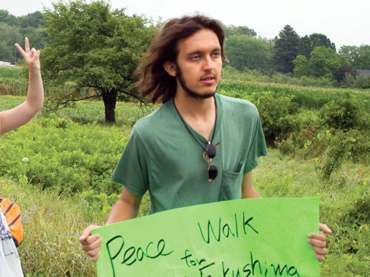 Alexander Ciccolo participates in a peace walk through Brighton, Ontario, in this July 26, 2012, photo. Law enforcement officials say Ciccolo was arrested after his father, a Boston police captain, alerted authorities that his son was talking about joining the Islamic State group and setting off bombs. Photo by Dave Fraser / Northumberland News via AP)