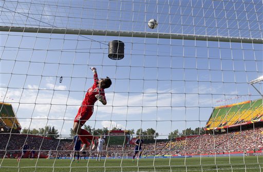 Japan goalkeeper Ayumi Kaihori makes a save against England in their semifinal in the FIFA Women's World Cup soccer tournament Wednesday in Edmonton, Alberta, Canada. The Associated Press