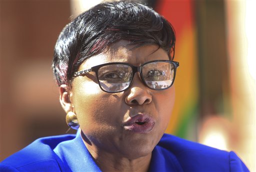Oppah Muchinguri, the Zimbabwean minister of  environment, water and climate, addresses a  press conference in Harare Friday. "We are appealing to the responsible authorities for (Walter Palmer's) extradition to Zimbabwe so that he be made accountable."  The Associated Press