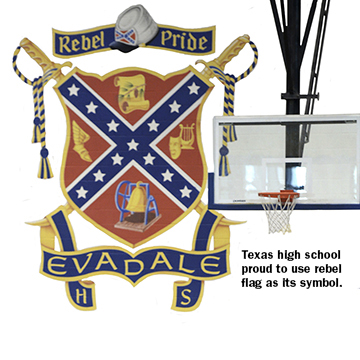 A work crew refinishes the gym floor near the Evadale High School's coat of arms on Wednesday, June 24, 2015. A few Texas school districts are under scrutiny for using Confederate symbols that backers say stand for tradition but critics believe are in support of racism. (Guiseppe Barranco/The Enterprise via AP) MANDATORY CREDIT, NO SALES, MAGS OUT, TV OUT, WEB: AP MEMBERS ONLY