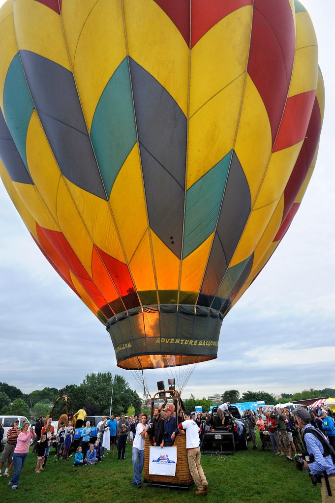 Frank Bart of Tampa, Florida, begins his liftoff of the first balloon to go up a little after sunrise at the 2015 Great Falls Balloon Festival  in Lewiston. Press Herald file photo