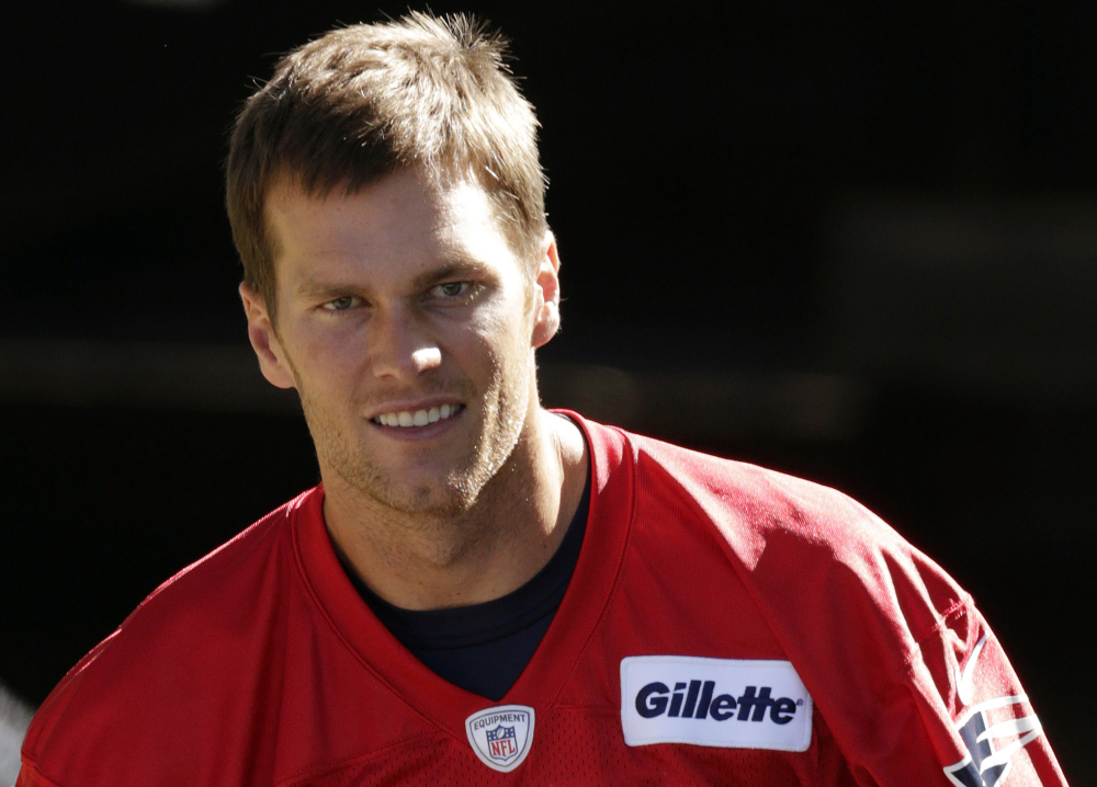 New England Patriots quarterback Tom Brady heads to the field for a recent practice in Foxborough, Mass.