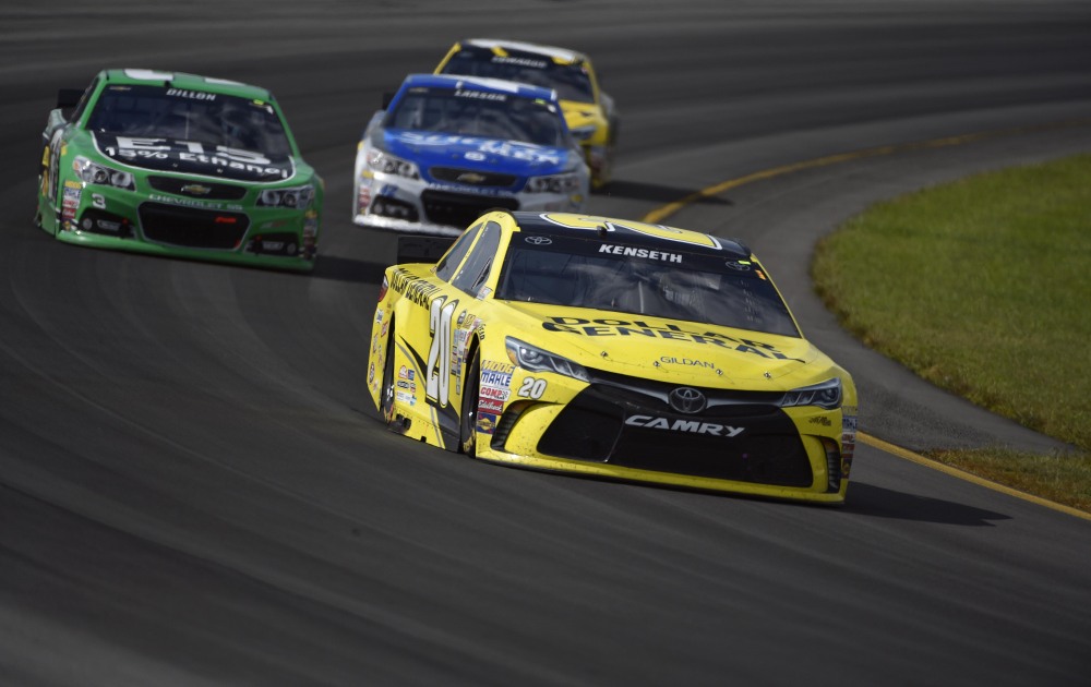 Matt Kenseth (20) drives through Turn 3 during the Pocono 400 on Sunday in Long Pond, Pa. Kenseth won the race.