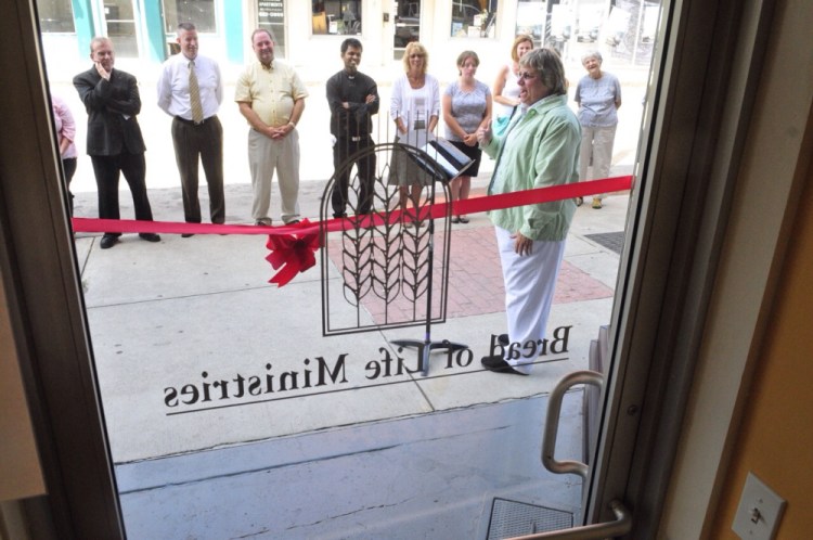 The Rev. Carolyn Neighoff, who founded Bread of Life, speaks Tuesday at a ribbon cutting for the group’s new Water Street office in Augusta.