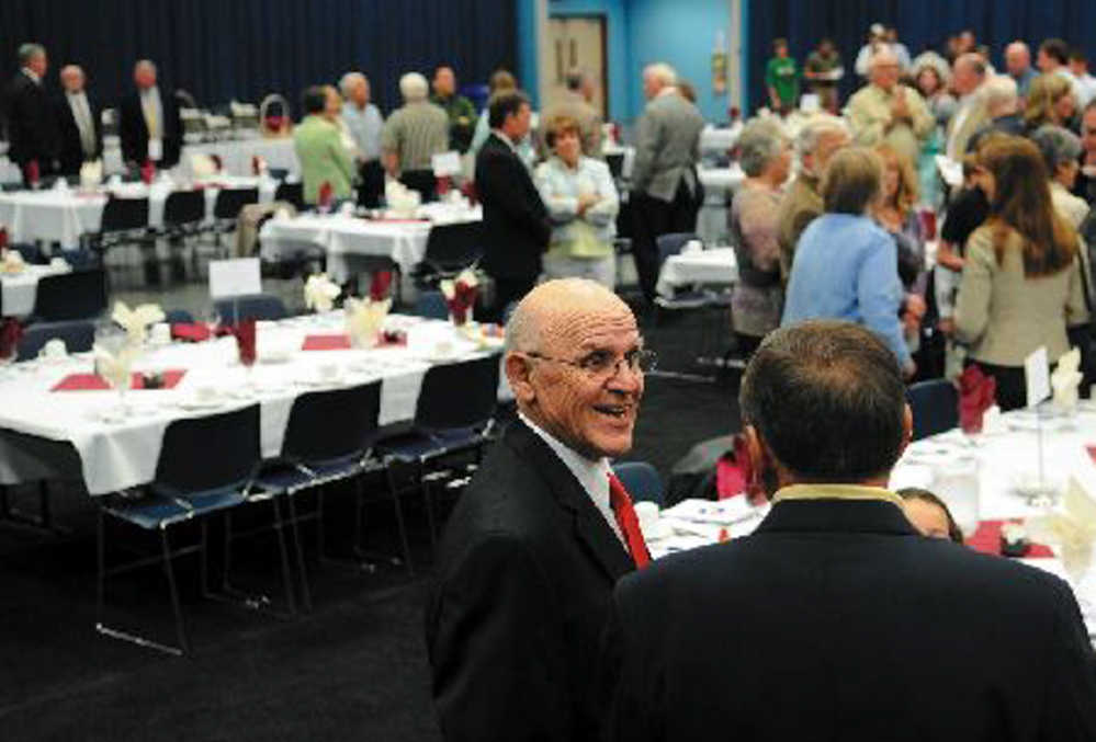 Harold “Tank” Violette greets well-wishers during the Maine Sports Hall of Fame banquet in 2011. Violette, one of three Winslow football coaches since 1958, died Tuesday.