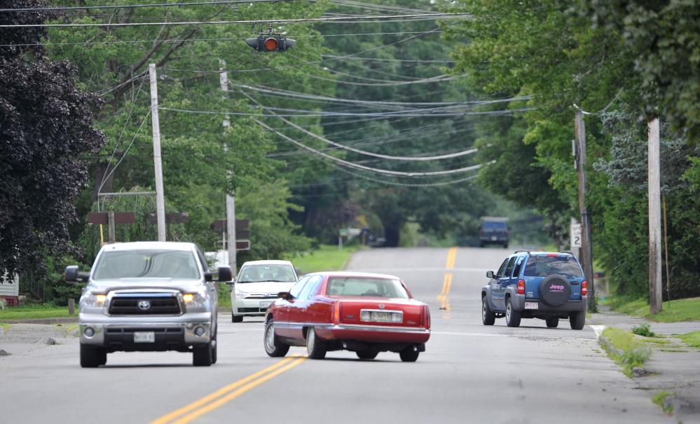 Cars travel on First Rangeway at the five-way intersection at Western Street on Wednesday. The city plans to make it a four-way intersection, but the bids came in so high the work won’t be done this year ar planned.