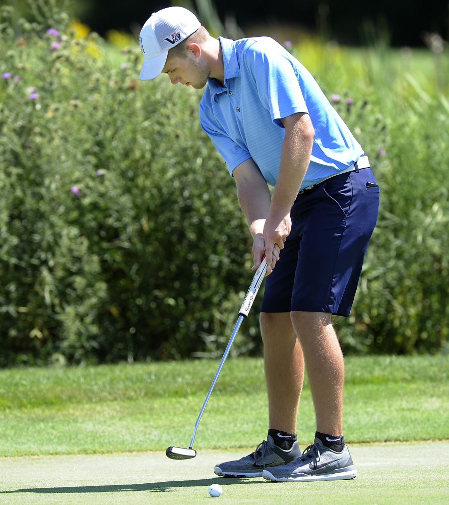 Carter Pearl of Newport keeps his head still as he makes an 18-foot birdie on the 18th hole to finish with a 79 for the first day of Maine Junior Golf Championship at Toddy Brook Golf course in North Yarmouth.