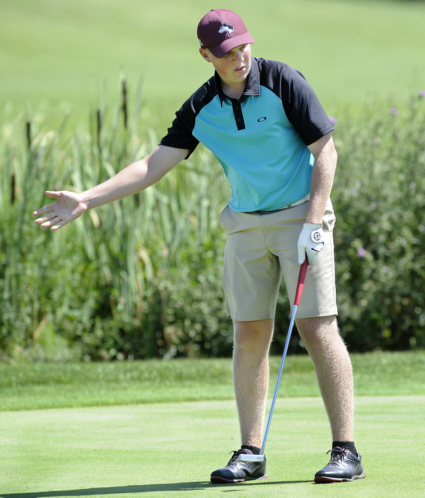 Eric Dugas, a student at Maine Central Institute in Pittsfield, reacts to a birdie putt on No. 18 that just slips by the hole on first day of Maine Junior Golf Championship at Toddy Brook Golf course in North Yarmouth.
