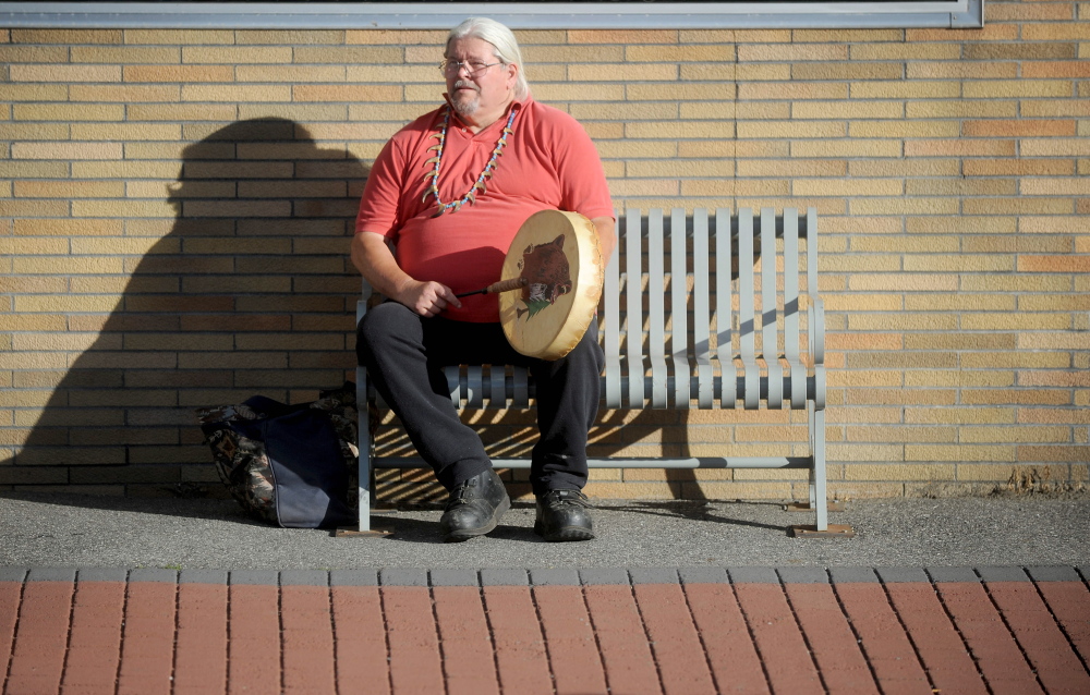 Mike Walton, of Clinton, plays his drum Thursday during a Native American rally at the Moonlight Madness festival on Water Street in Skowhegan.