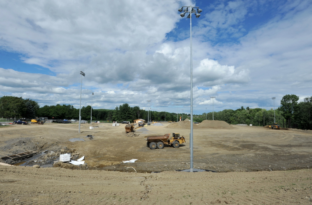 Construction crews work on the new baseball and complex Thursday at Colby College in Waterville.