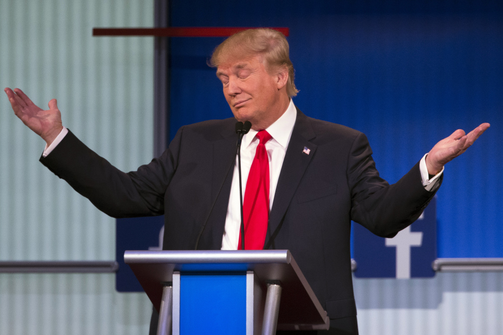 Republican presidential candidate Donald Trump gestures during the first Republican presidential debate at the Quicken Loans Arena Thursday in Cleveland.