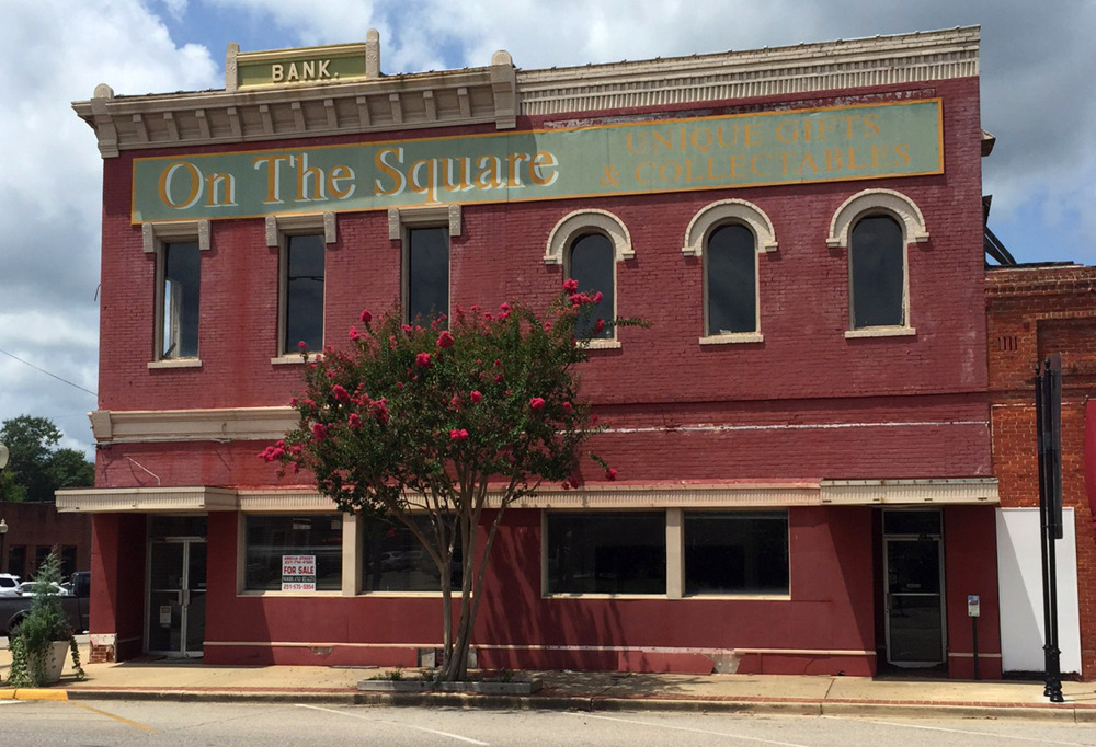 This Aug. 6, 2015, shows the old bank building that once housed the office of author Harper Lee’s father A.C. Lee on the courthouse square in Monroeville, Ala.