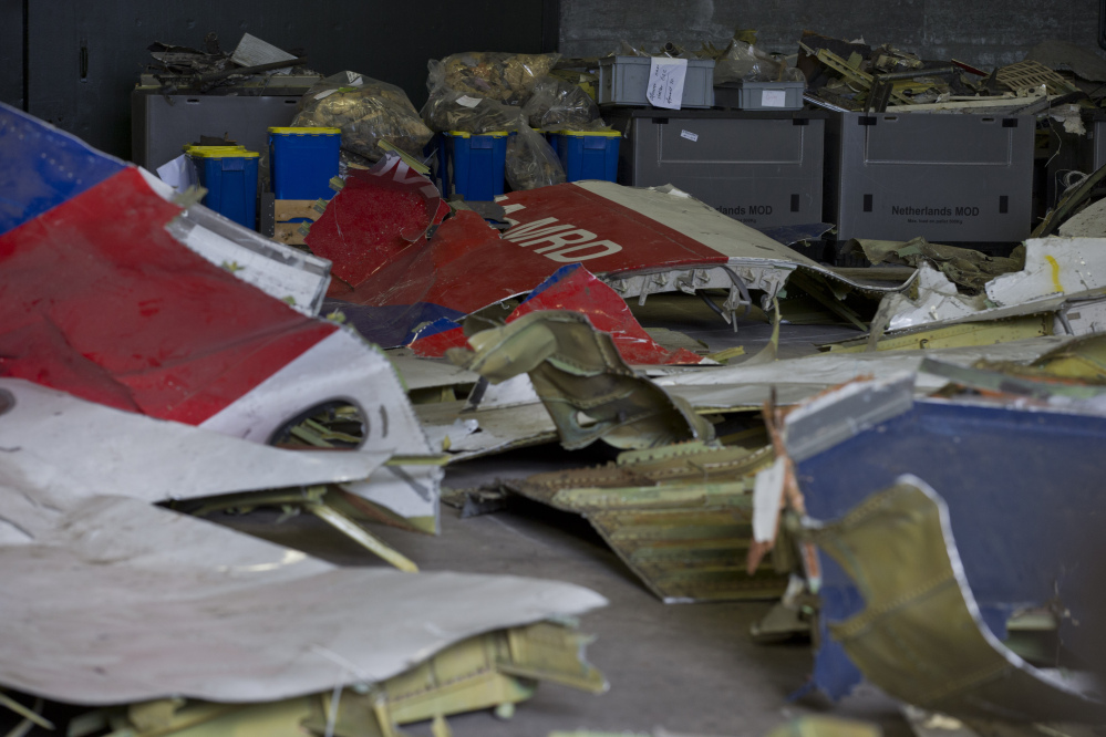 In this March 3, 2015 file photo parts of the wreckage of the Malaysia Airlines Flight 17 are displayed in a hangar at Gilze-Rijen airbase, Netherlands.