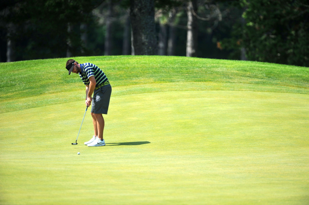 Staff photo by Michael G. Seamans
In this July 7 photo, Andrew Slattery attempts a putt on the 15th hole in the first round of the Maine Amateur Championship at Waterville Country Club in Oakland. Slattery survived a 20-hole match with Joe Walp Wednesday at Martindale Country Club to advance to the finals of the Match Play Invitational.