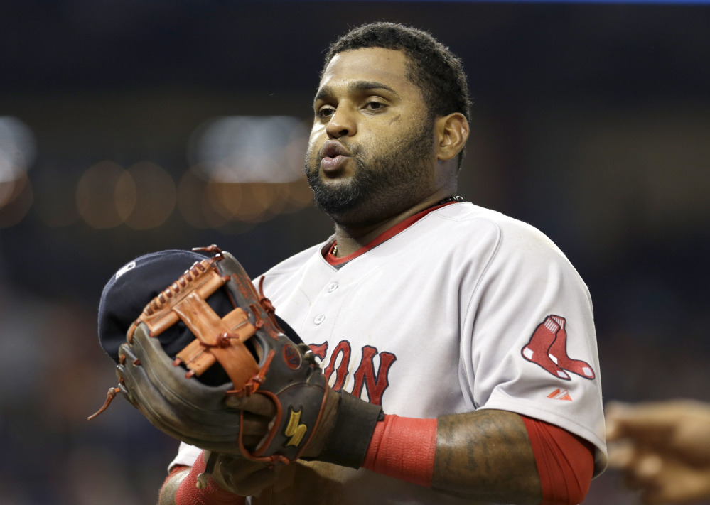 Boston Red Sox third baseman Pablo Sandoval heads to the dugout at the end of the seventh the inning of a game against the Miami Marlins Wednesday in Miami. The Marlins won 14-6.