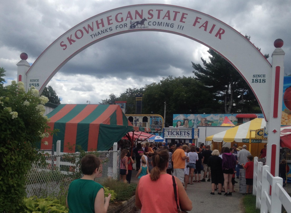 Fairgoers enter the 197th Skowhegan State Fair Thursday on opening day. The fair runs through Saturday, Aug. 22.