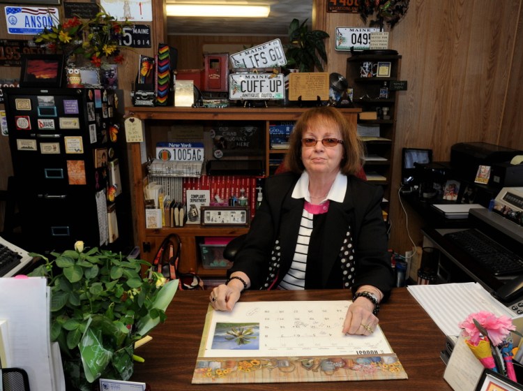 Claudia Viles, tax collector for the town of Anson, sits at her desk Thursday at the Town Office in Anson. Despite a lawsuit against Viles by the town related to $438,000 in missing town money, she is still working.