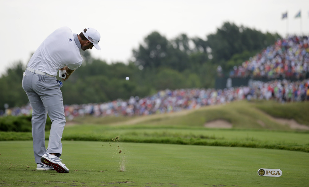 Dustin Johnson hits a tee shot on the 17th hole during the first round of the PGA Championship golf tournament Thursday at Whistling Straits in Haven, Wis. Johnson shot a 6-under 66 to take the lead after Day 1.
