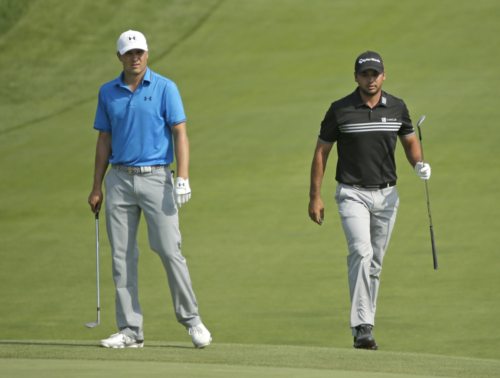 Jordan Spieth, left, and Jason Day, right, of Australia, walk to the ninth green during the fourth round of the PGA Championship golf tournament Sunday at Whistling Straits in Haven, Wis.