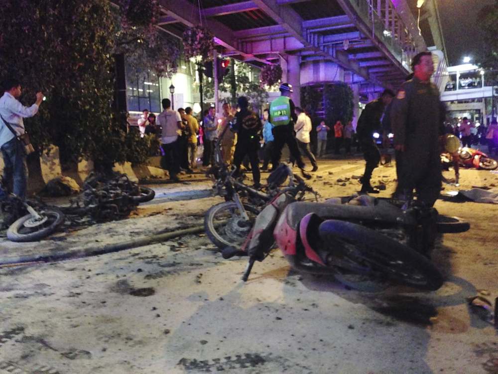 Motorcycles are strewn about after an explosion in Bangkok, Monday.