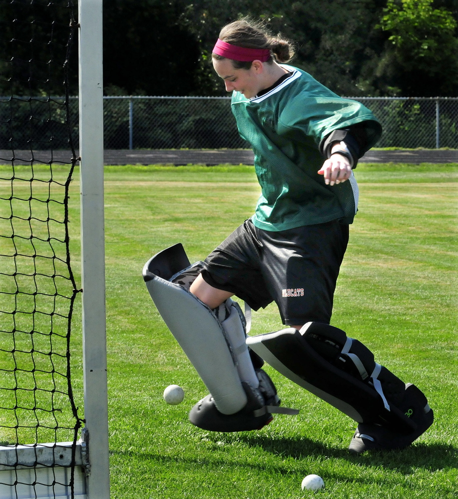Winslow High School field hockey goalie Delaney Wood does drills during practice Monday.