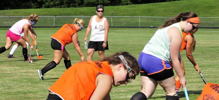 Winslow field hockey head coach Mary Beth Bourgoin leads the team in practice Monday on Monday in Winslow.