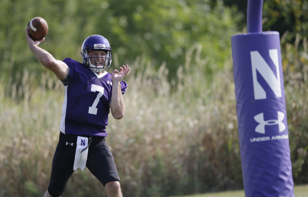 Northwestern football player Matt Alvita throws during practice at the University of Wisconsin-Parkside campus on Monday, in Kenosha, Wi. The National Labor Relations Board on Monday overturned a historic ruling that gave Northwestern University football players the go-ahead to form the nation’s first college athletes’ union, saying the prospect of union and non-union teams could throw off the competitive balance in college football.